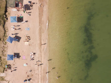 Aerial top down view of a beach of the Azov sea. Summer vacation time. Shelkino. Crimea.の写真素材