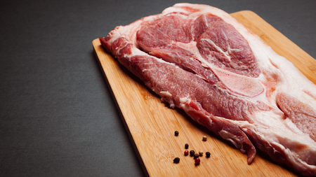 Raw meat on cutting board