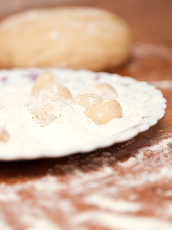 Dumplings and parsley - russian pelmeni. Cook dumplings. Pasta ravioli over wooden deskの写真素材