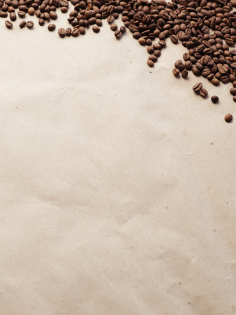 Coffee beans on paper background. Paper texture coffee. Dark coffee roasted. Coffee beansの写真素材