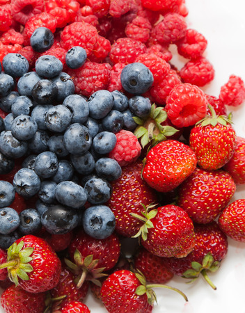 Berries in a bowl on white backgroundの写真素材
