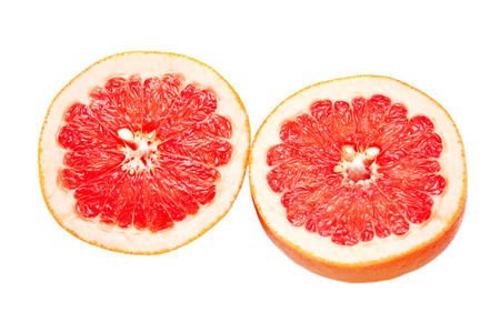grapefruit cut into two segmentsの写真素材