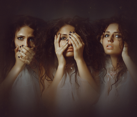 Beautiful young girl. Not see, not hear, not speak. Not want and will not.の写真素材