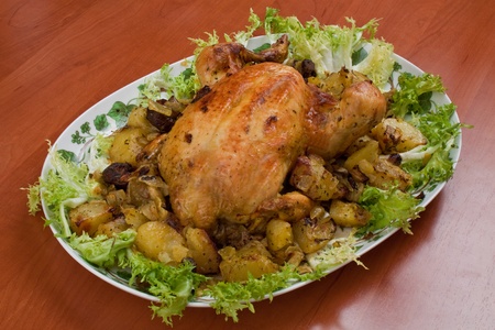 a dish of chicken with salad on the kitchen tableの写真素材