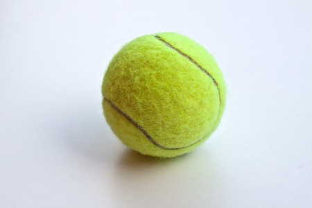 tennis ball on a white backgroundの写真素材