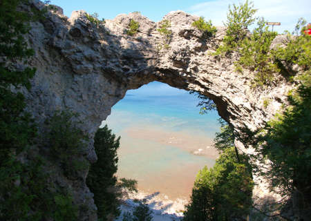 Archway in the rocks to the beachの写真素材