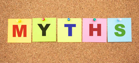 Color notes with letters pinned on a board. Word MYTHS.の写真素材