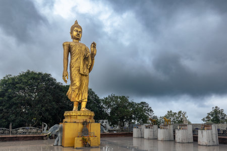 Golden standing Big Buddha statue on a square under cloudy sky, Koh Samui, Thailandの写真素材