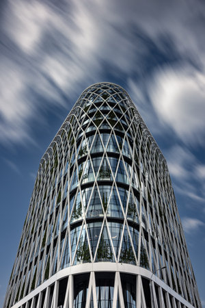 Bottom up view of contemporary  office center building against sky with blurred clouds, Moscow, Russiaの写真素材