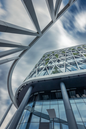Bottom up view of contemporary  office center building against sky with blurred clouds, Moscow, Russiaの写真素材