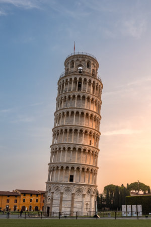 Piazza del Duomo with Leaning Tower at golden sunrise against colorful sky, Pisa, Italyの写真素材