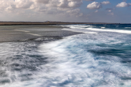 Egyptian natural landscape with empty desert and coast of Red sea under with blurred waves, Egypt
