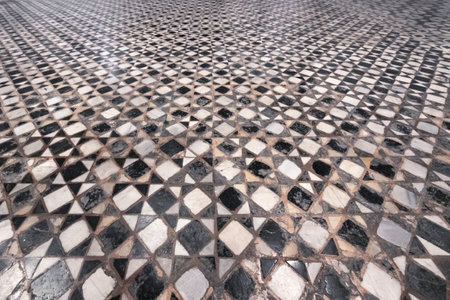 Intricate pattern of multi colored marble floor in ancient Battistero di San Giovanni, Florence, Italyの写真素材
