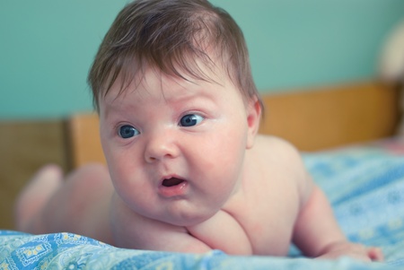 a new born boy lying on the nappiesの写真素材