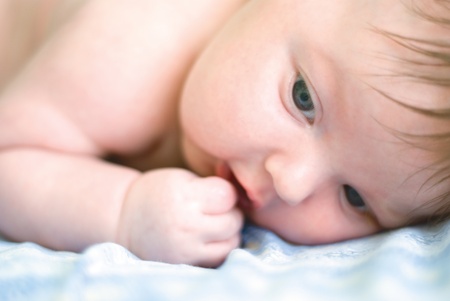 a new born boy lying on the nappiesの写真素材