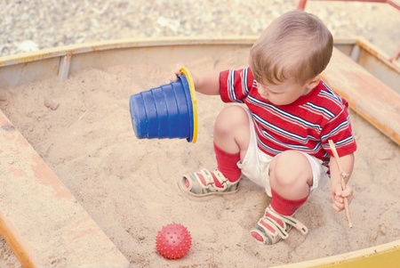 a young boy on playgroundの写真素材