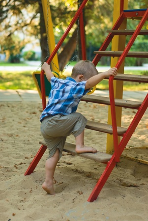 a little boy on playgroundの写真素材