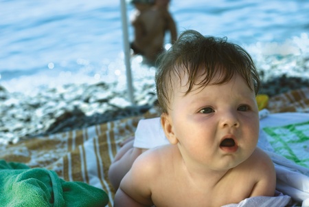 a baby on the beachの写真素材
