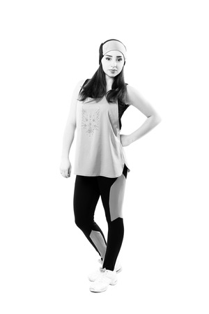 young professional cheerleaders posing at studio. Isolated over white. Black and white photographyの写真素材