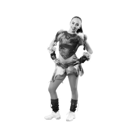Young professional cheerleader dressed in a warrior costume posing at studio. Isolated over white. Black and white photographyの写真素材