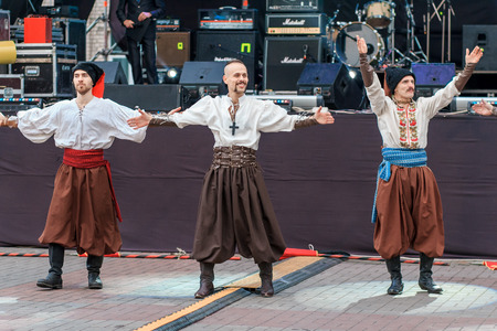Dneprodzerzhinsk, Ukraine - October 15, 2016: theatrical performance of Ukrainian cossacks, dances and elements of combat with sabersのeditorial素材