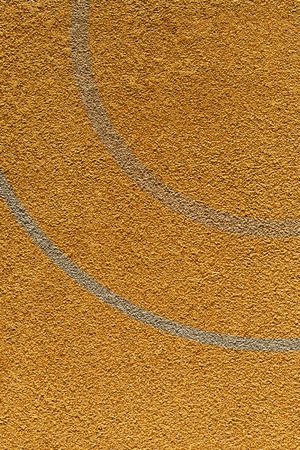 Yellow rough wall texture with a dividing stripの写真素材