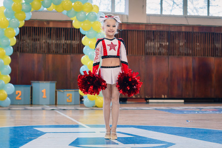 Dneprodzerzhinsk, Ukraine - November 12, 2016: Qualifying round for the cheerleading competition. Cup "Prometheus" , young cheerleaders perform at the city cheerleading championshipのeditorial素材