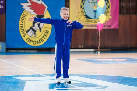 Kamenskoye, Ukraine - March 8, 2017: Championship of the city of Kamenskoye in cheerleading among solos, duets and teams, young boys cheerleaders perform at the city cheerleading championshipのeditorial素材