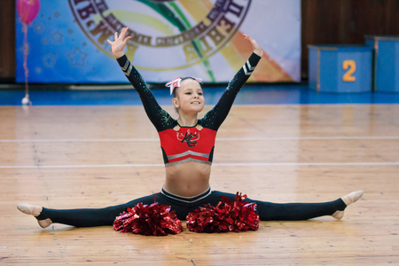 Kamenskoye, Ukraine - March 8, 2017: Championship of the city of Kamenskoye in cheerleading among solos, duets and teams, young cheerleaders perform at the city cheerleading championshipのeditorial素材
