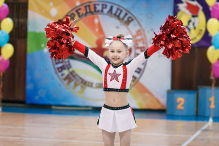 Kamenskoye, Ukraine - March 8, 2017: Championship of the city of Kamenskoye in cheerleading among solos, duets and teams, young cheerleaders perform at the city cheerleading championshipのeditorial素材