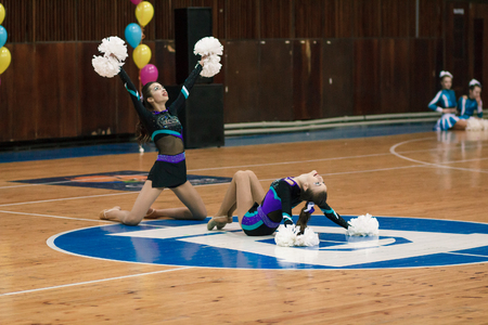 Kamenskoye, Ukraine - March 8, 2017: Championship of the city of Kamenskoye in cheerleading among solos, duets and teams, young cheerleaders perform at the city cheerleading championshipのeditorial素材