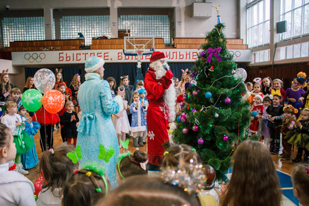 Kamenskoye, Ukraine - December 26, 2016: Christmas party for federation of cheerleading in Kamenskoye, Father Frost plays with children and leads a round danceのeditorial素材