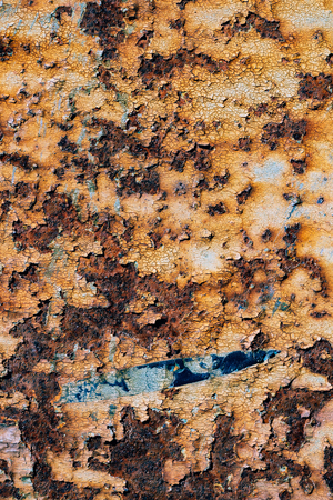 texture of rusty iron, cracked paint on an old metallic surface, sheet of rusty metal with cracked...