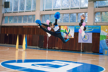 Kamenskoye, Ukraine - November 28, 2017: Championship of the city of Kamenskoye in cheerleading among solos, duets and teams, young cheerleaders perform at the city cheerleading championshipのeditorial素材