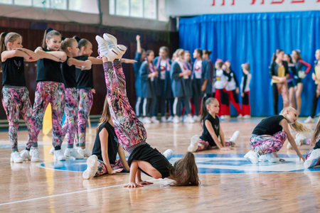 Kamenskoye, Ukraine - November 29, 2017: Championship of the city of Kamenskoye in cheerleading among solos, duets and teams, young cheerleaders perform at the city cheerleading championshipのeditorial素材