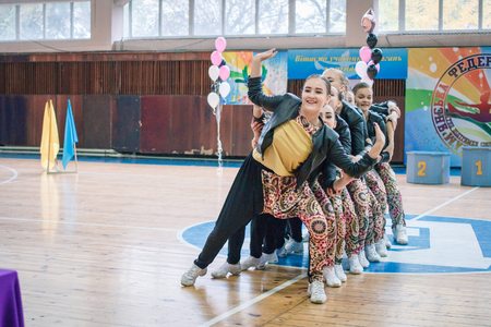 Kamenskoye, Ukraine - November 29, 2017: Championship of the city of Kamenskoye in cheerleading among solos, duets and teams, young cheerleaders perform at the city cheerleading championshipのeditorial素材