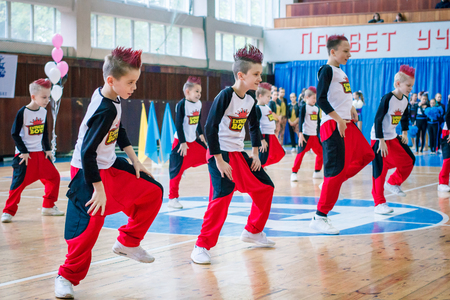 Kamenskoye, Ukraine - November 29, 2017: Championship of the city of Kamenskoye in cheerleading among solos, duets and teams, young boys cheerleaders perform at the city cheerleading championshipのeditorial素材