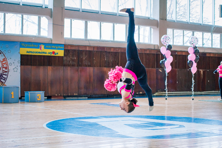 Kamenskoye, Ukraine - February 18, 2018: Championship KPSK "Prometheus" on
cheerleading, young cheerleaders perform at the city cheerleading championshipのeditorial素材