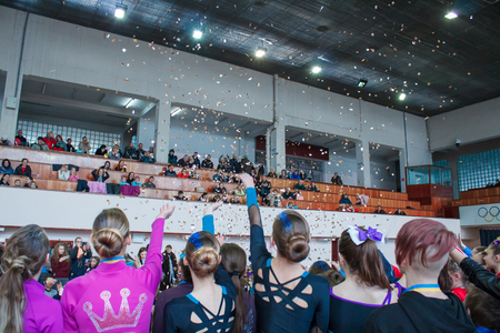 Kamenskoye, Ukraine - February 18, 2018: Championship KPSK "Prometheus" on cheerleading, salute of golden confetti during the awardsのeditorial素材