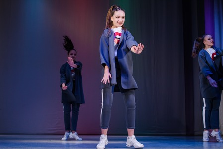 Kamenskoye, Ukraine - November 14, 2018: Championship of the city of Kamenskoye in cheerleading among duets and teams, young cheerleaders perform at the city cheerleading championshipのeditorial素材