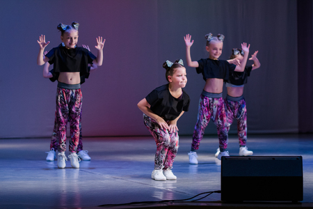 Kamenskoye, Ukraine - November 14, 2018: Championship of the city of Kamenskoye in cheerleading among duets and teams, young cheerleaders perform at the city cheerleading championshipのeditorial素材