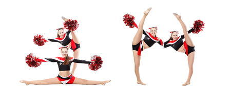 Two professional cheerleaders with pompoms posing at studio. Vertical split. Isolated over white. girl dancer practicing mixed dance and stretching, extending leg up, vertical twine, image setの写真素材