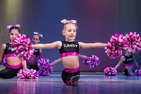 Kamenskoye, Ukraine - October 14, 2018: Championship of the city of Kamenskoye in cheerleading among duets and teams, young cheerleaders perform at the city cheerleading championshipのeditorial素材
