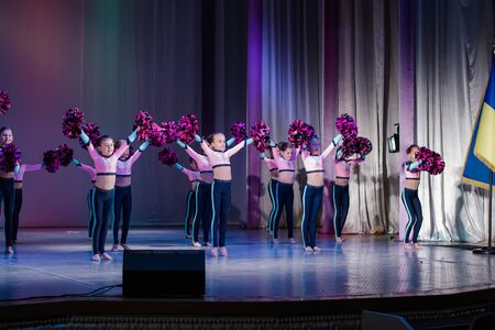 Kamenskoye, Ukraine - October 14, 2018: Championship of the city of Kamenskoye in cheerleading among duets and teams, young cheerleaders perform at the city cheerleading championshipのeditorial素材