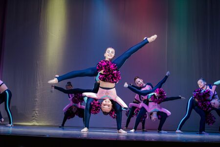 Kamenskoye, Ukraine - October 14, 2018: Championship of the city of Kamenskoye in cheerleading among duets and teams, young cheerleaders perform at the city cheerleading championshipのeditorial素材