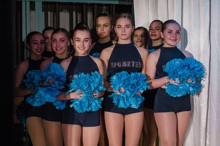 Kamenskoye, Ukraine - October 14, 2018: team of young girls - athletes are preparing for the show,...
