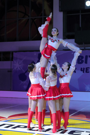 Kamianske, Ukraine - February 16, 2020: cheer stunt, cup of Dnipropetrovsk region from cheerleading among solo, duets and teams, young cheerleaders perform at the city cheerleading championshipのeditorial素材