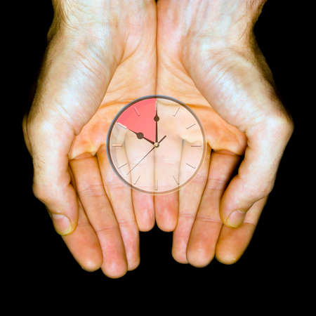Time Over, clock in handsの写真素材