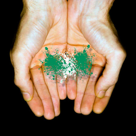 Made in Nigeria, country flag in two hands の写真素材