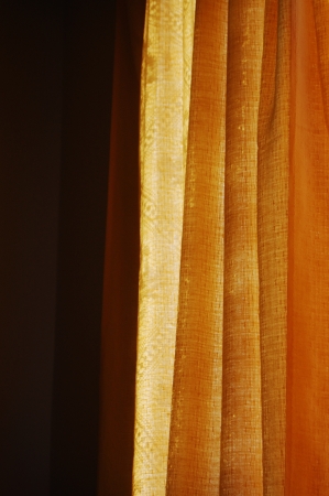 Sun shining through the curtainの写真素材